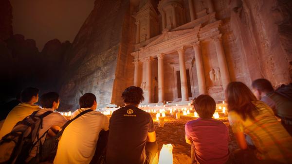 group of travellers outside the gates of petra in jordan