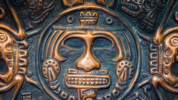 Mayan carvings in black and gold from Guatemala